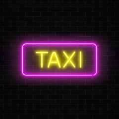 Neon uber and taxi transportation services signs in a geometrical shape on a brick background.