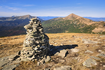 Ukraine, Zakarpattia region, Rakhiv district, Carpathians, Chornohora, Landscape with mountain Hoverla, mountain Turkul, and stone stack