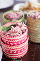 Fototapeta premium Brown sticky rice with the sticker rice wicker