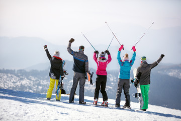 Back view of skiers in mountain