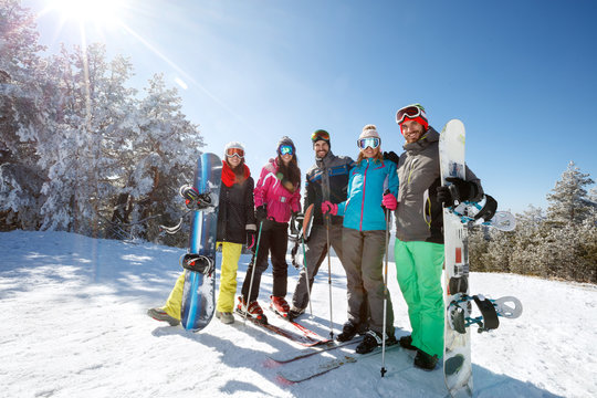 Group of skiers and boarders together on mountain