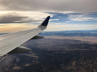 Fototapeta premium sunset and airplane wing over Lake Tahoe and Reno