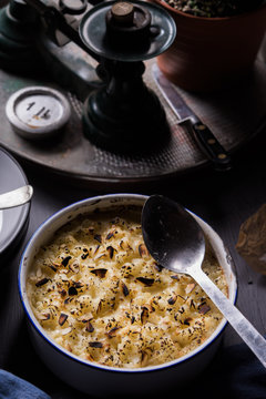 Fish pie,fresh from oven topped with cheese,potato and almonds.
