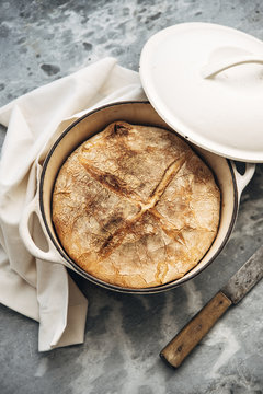 Food: Loaf of white wheat bread baked in an iron cast pot