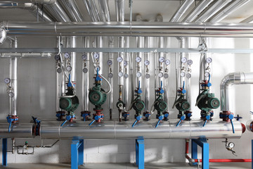 pump , manometer, pipes and faucet valves of heating system in a boiler room