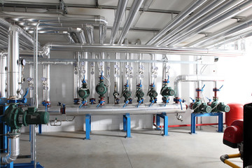 pump , manometer, pipes and faucet valves of heating system in a boiler room