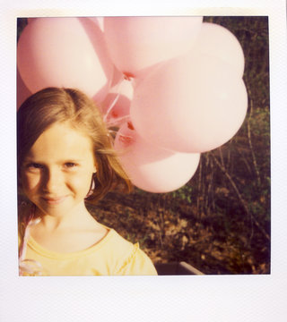 A Girl Holding A Bunch Of Pink Balloons On A Spring Evening