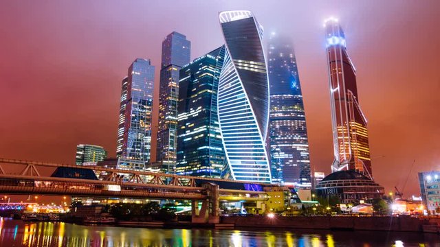 Zoom out Timelapse hyperlapse of Moscow city international business district at night