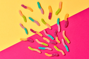 Gummy Candies background, Sweets. Flat lay. Summer Party, Pink Birthday Firework. Bright Colorful Layout. Fun Trendy fashion Style. Minimal. Pop Art