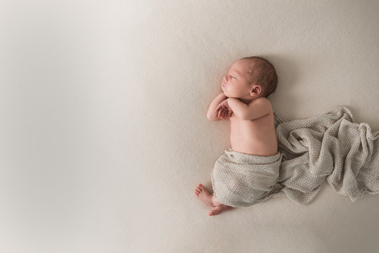 A Baby With Negative Space Sleeping