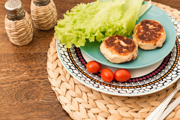 Juicy homemade cutlets (beef, pork, chicken) on a wooden background. The concept of a healthy diet.