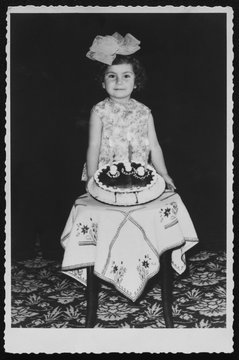 Young girl celebrating her third birthday in 1968
