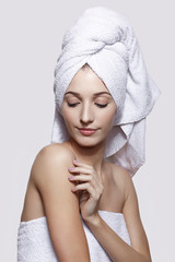 Young woman with bath towel on the head