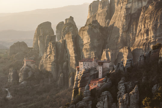 roussanou nunnery with agios nikolaos monastery in the back at sunset - meteora - greece