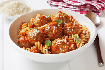 Meatballs with marinara, fusili pasta and parmesan cheese. Meatballs made from turkey mince.
