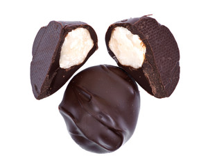 Dark chocolate covered  macadamia nuts isolated on white background