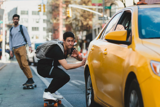 Young man riding skateboard in the city