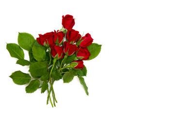 Bouquet of red roses on a white background with space for text. Top view, flat lay. Valentine decoration.