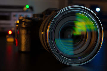 Fototapeta na wymiar Photo Camera or Video lens close-up on black background DSLR objective