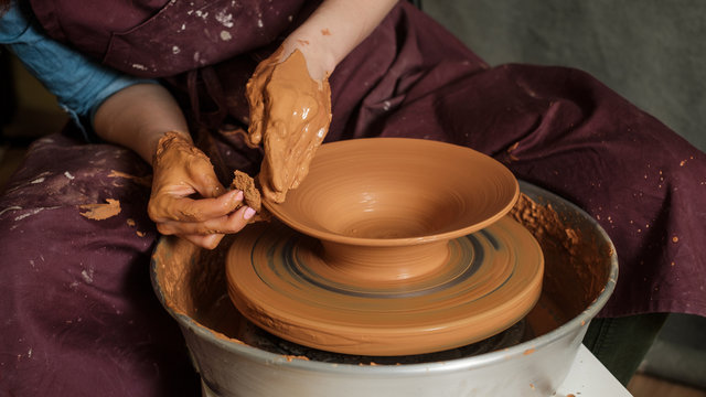 Woman Working On Pottery Wheel