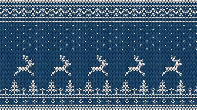 Knitted Scandinavian pattern with deer, firs, ornaments and falling snow. White on a blue background.