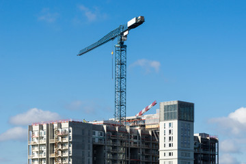 Fototapeta na wymiar crane on top of a new house - construction site