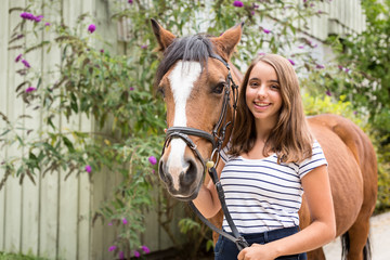 Teenage Girl With Her Pony