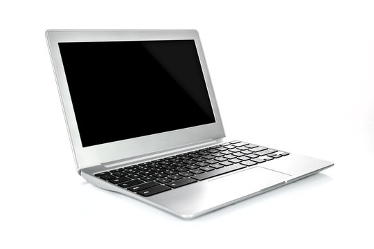 Mock Up Of A Luxury And Modern Generic Laptop In A Metal Case In Close-up On A White Background.