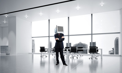Businessman with monitor instead of head.