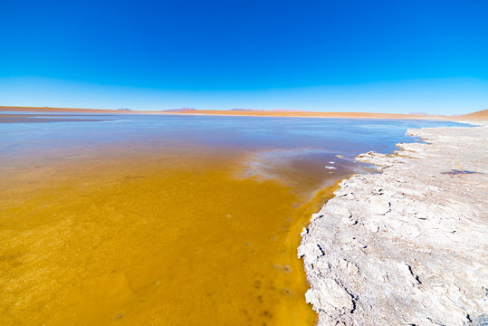 Frozen salt lake on the Andes, road trip to the famous Uyuni Salt Flat, travel destination in Bolivia.