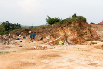 Lugazi, Uganda. June 18 2017. Ugandan women breaking rocks in a quarry.