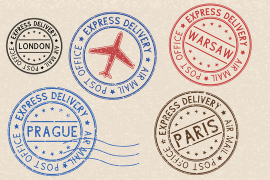 Set of colored ink postmarks with european cities. On beige background