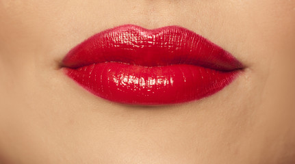 woman's lips with red lipstick