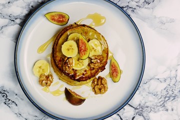 Gluten free banana pancakes on the light background. Top view