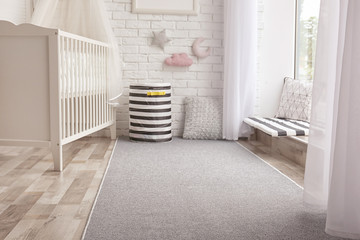 Child's room interior with grey carpet