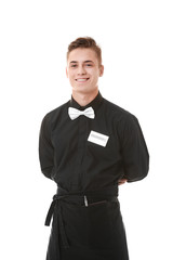 Handsome young waiter on white background