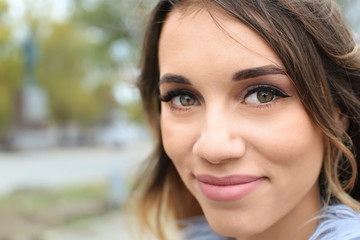 Fototapeta premium Attractive smiling woman outdoors