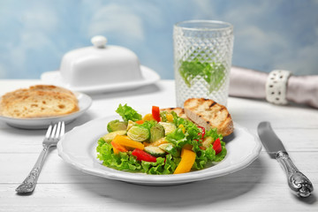 Plate of salad with Brussels sprouts on table