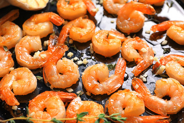 Delicious fried shrimps with garlic, closeup