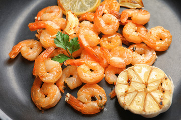 Delicious shrimps with garlic in frying pan, closeup