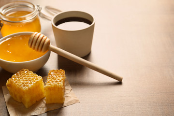 Fresh honeycombs on wooden table, closeup