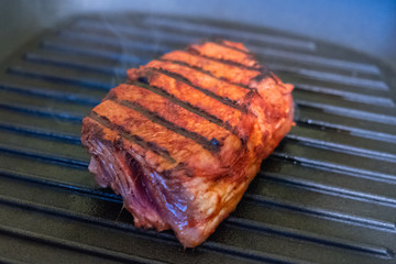 Three steaks roasted on the grill