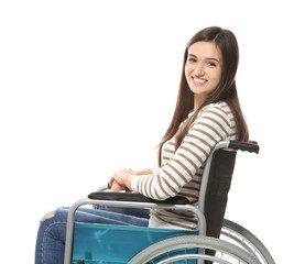 Young woman in wheelchair on white background