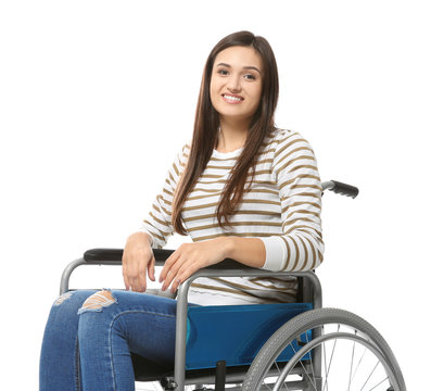 Young woman in wheelchair on white background