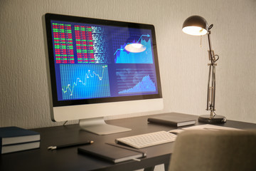Modern comfortable workplace with computer on desk at home