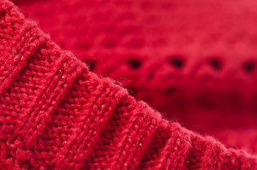 Fototapeta na wymiar Wool fabric red macro photo