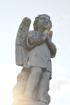 Cherub statuette, angel guardian figure of a praying Cherub, antique statue of angel.