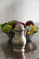 tin pitcher and a fruit bowl antique still life