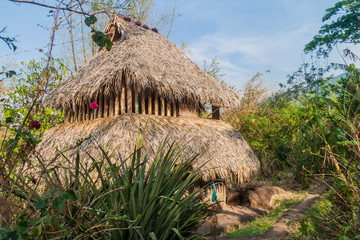 Fototapeta na wymiar Thatched hut, part of a hostel on Ometepe island, Nicaragua