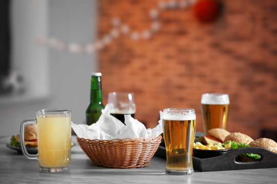 Table served with beer and snacks in sport bar